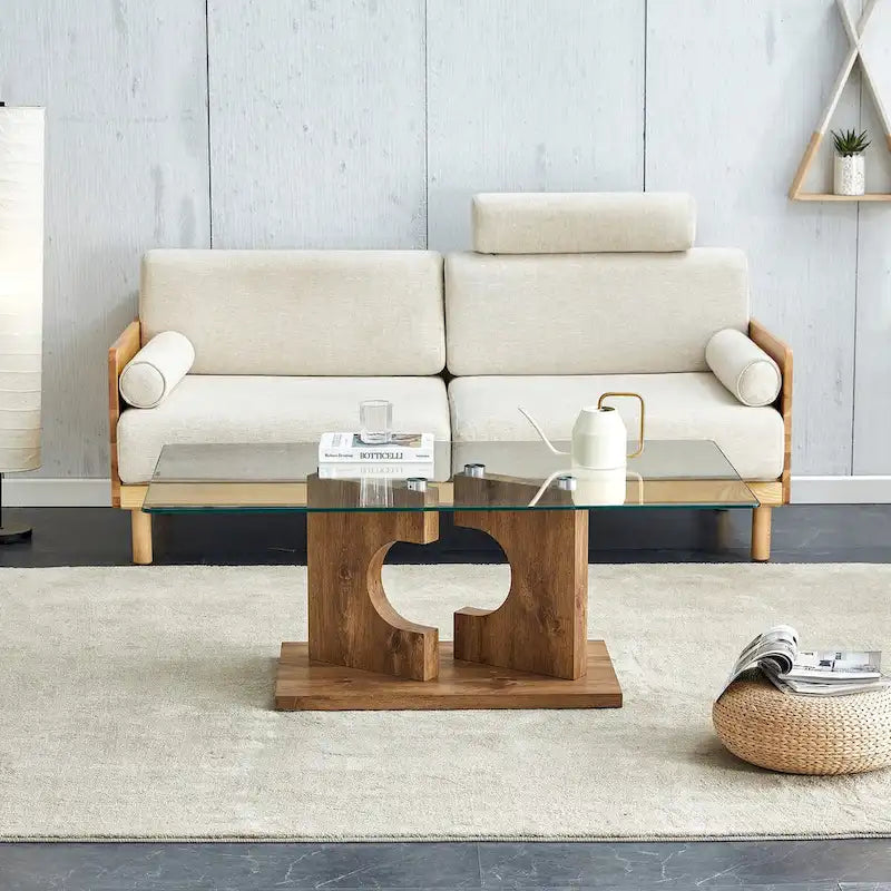 Un tavolino da caffè rettangolare moderno e alla moda con piano in vetro temperato e gambe in MDF bianco